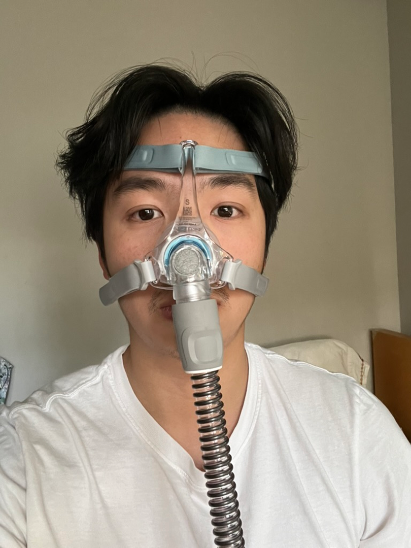 The designer wearing a CPAP mask